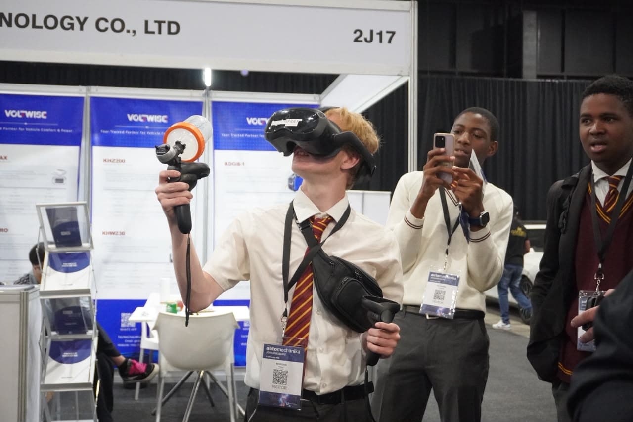 High school students participating in virtual reality spray painting. Photo taken by Zebrena Ralph.